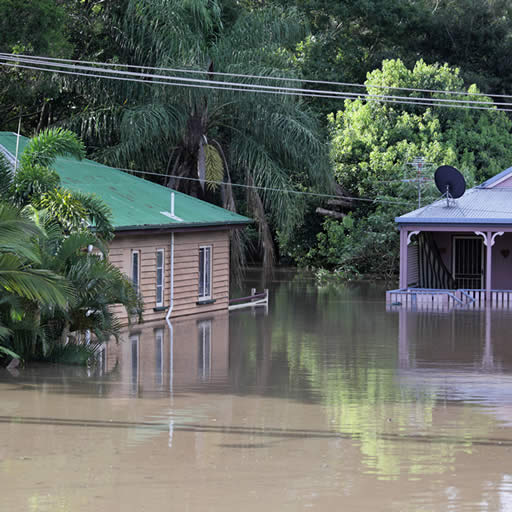 Houses partially submerged in floodwaters.